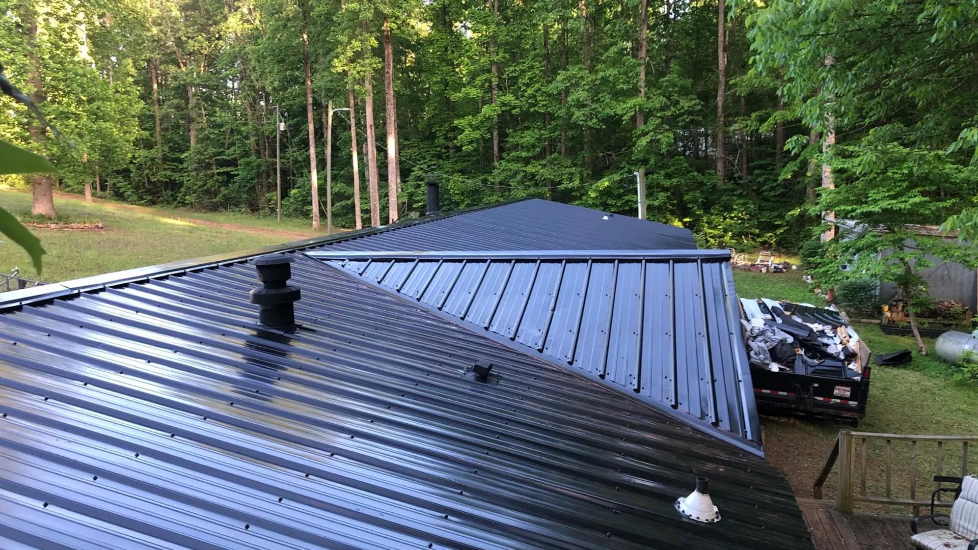 Standing seam metal roof installed by True North Roofing on a wooded Western North Carolina property